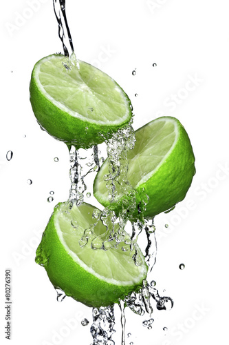 Three slices of lime poured with water