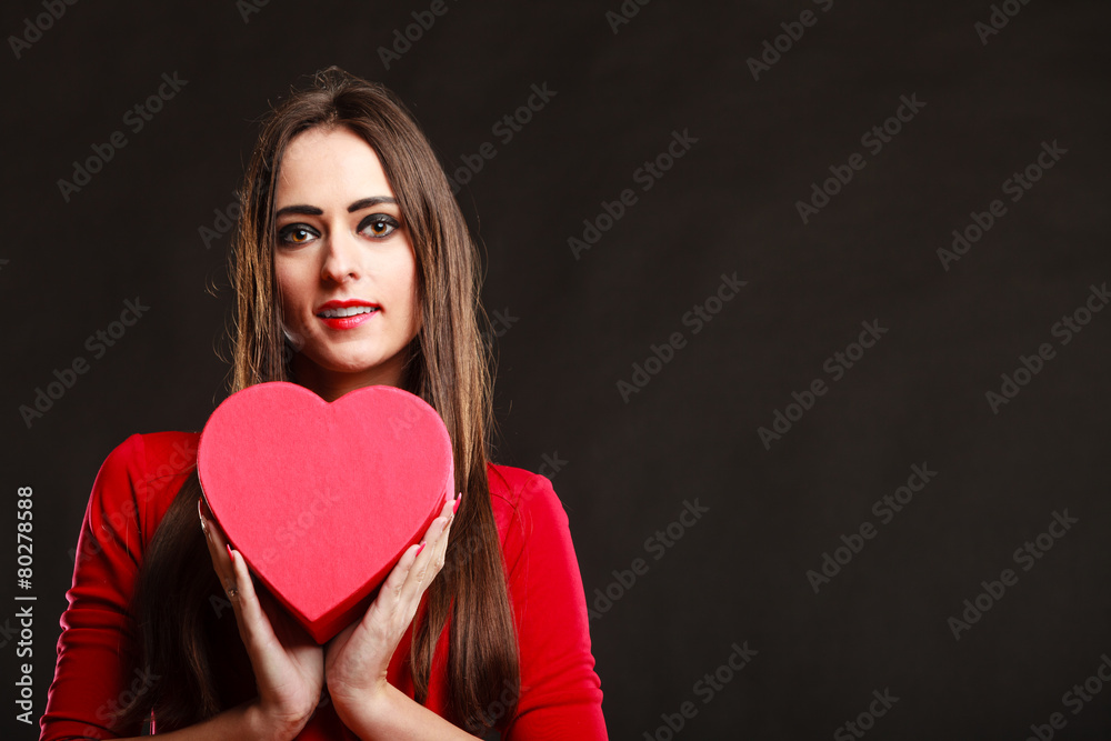 Girl in red holding heart box. Girl in red holding heart box.