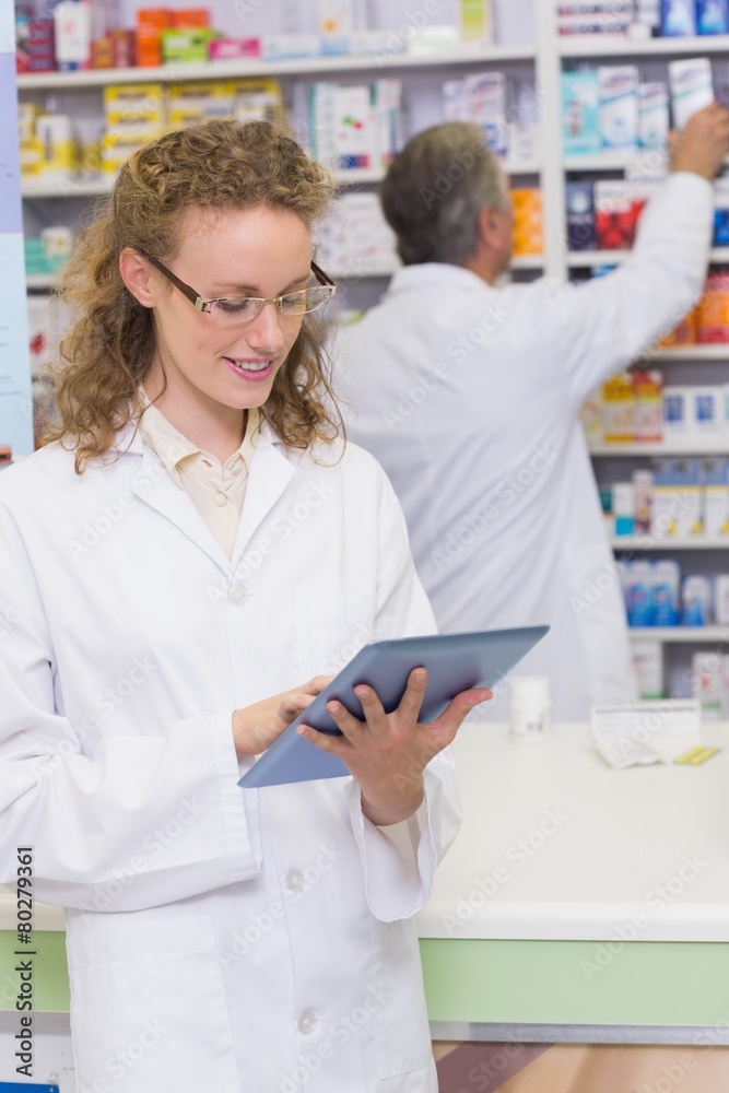 Pharmacist using tablet pc Pharmacist using tablet pc