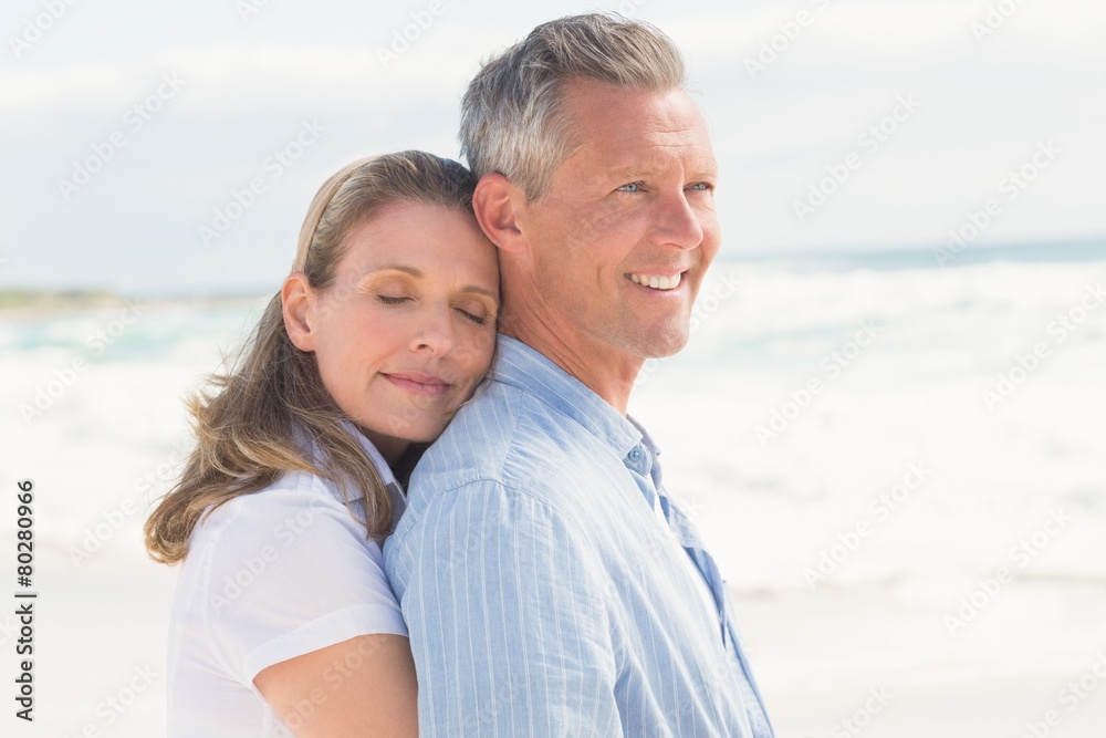 Happy couple standing and hugging Happy couple standing and hugging