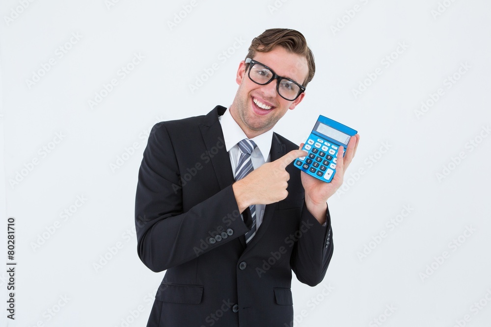 Geeky businessman pointing to calculator Geeky businessman pointing to calculator