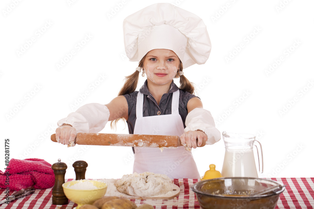 Сute little girl baking on kitchen and shows rolling-pin Сute little girl baking on kitchen and shows rolling-pin