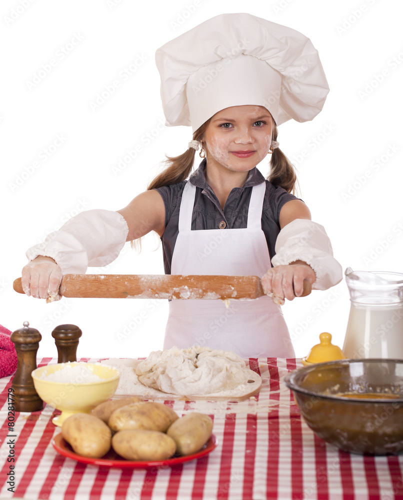 Сute little girl baking on kitchen and shows rolling-pin Сute little girl baking on kitchen and shows rolling-pin