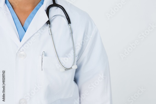 Foto Doctor standing with stethoscope