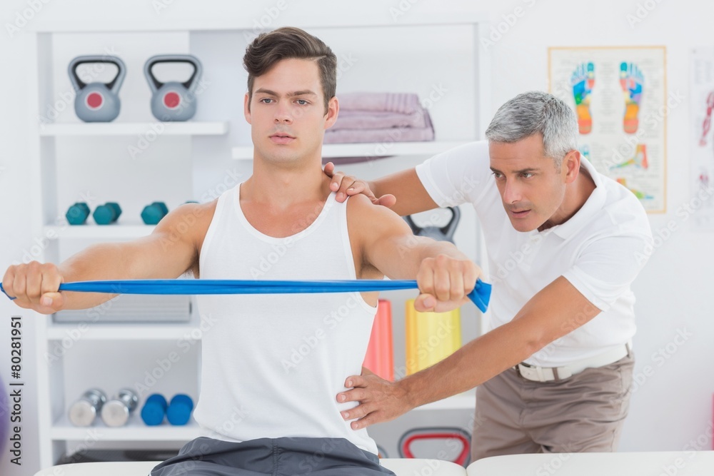 Fototapeta premium Doctor examining his patient back