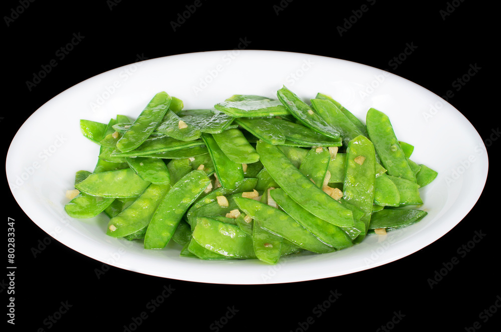 Stir fried snow peas and minced garlic Stir fried snow peas and minced garlic