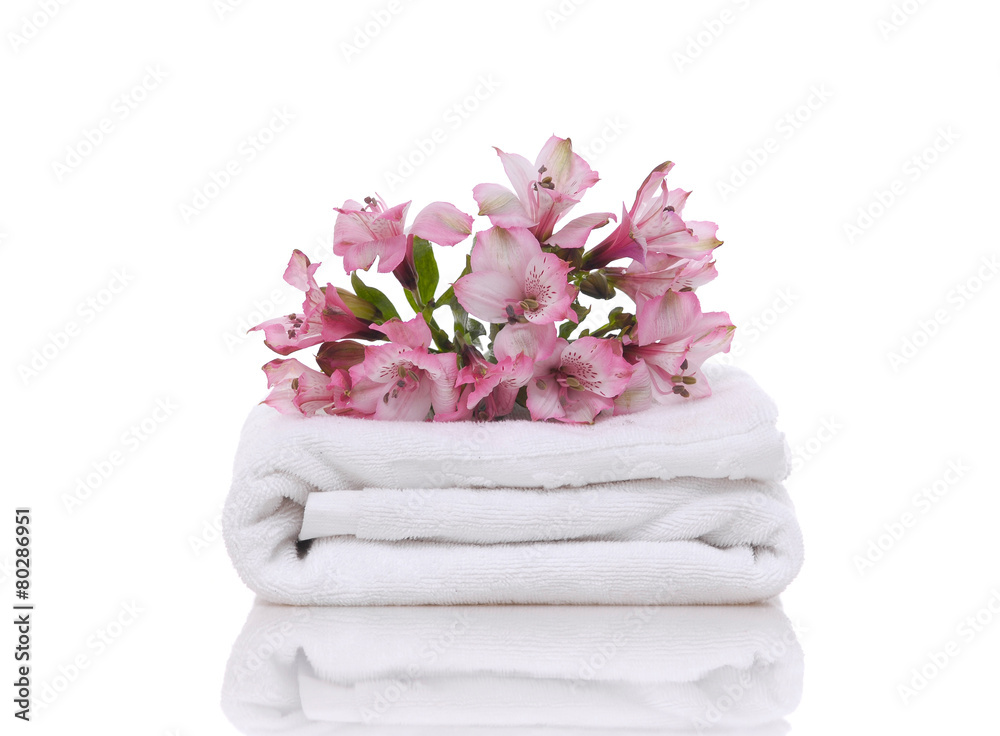 Branch pink lily and towel on white background Branch pink lily and towel on white background