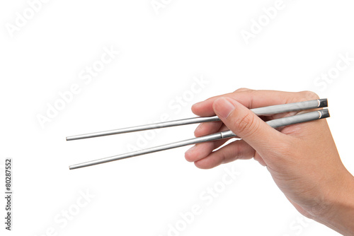 hand holding iron chopsticks, isolated on white,clipping path
