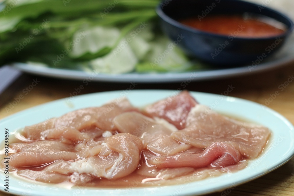 Raw pork in the dish for sukiyaki.