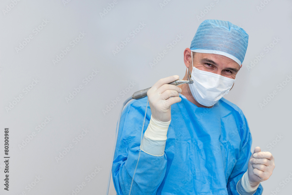 Dentists during surgery for implant placement Dentists during surgery for implant placement