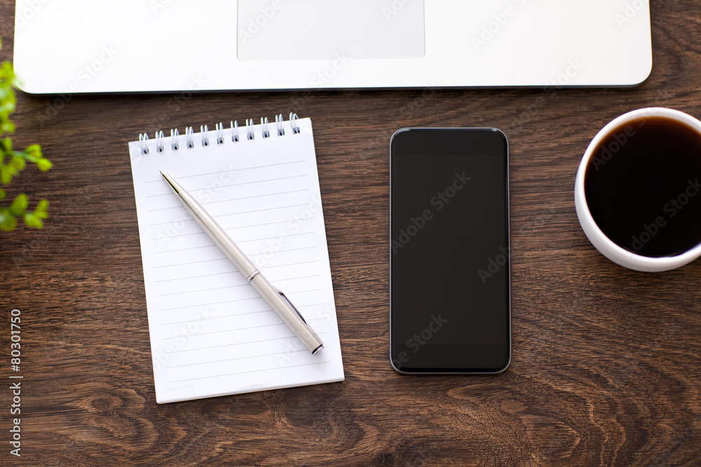 phone lying on a wooden table in the office phone lying on a wooden table in the office