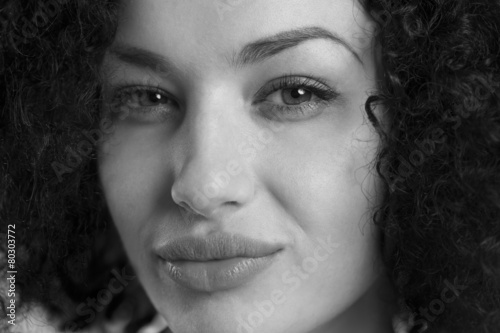 Close up of a woman with sexy look in black and white.