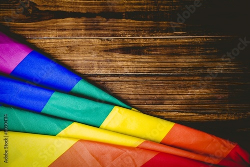 Photo Gay pride flag on wooden table