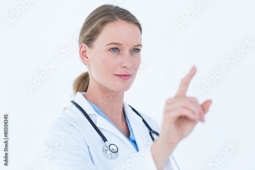 Young doctor pointing