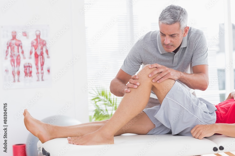 Fototapeta premium Man having leg massage