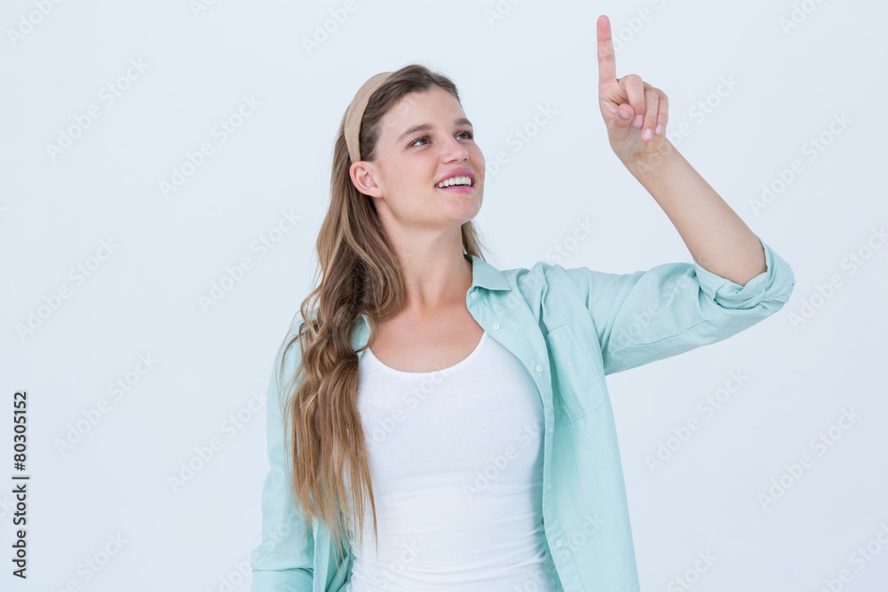 Fototapeta premium Pretty hipster pointing with her finger