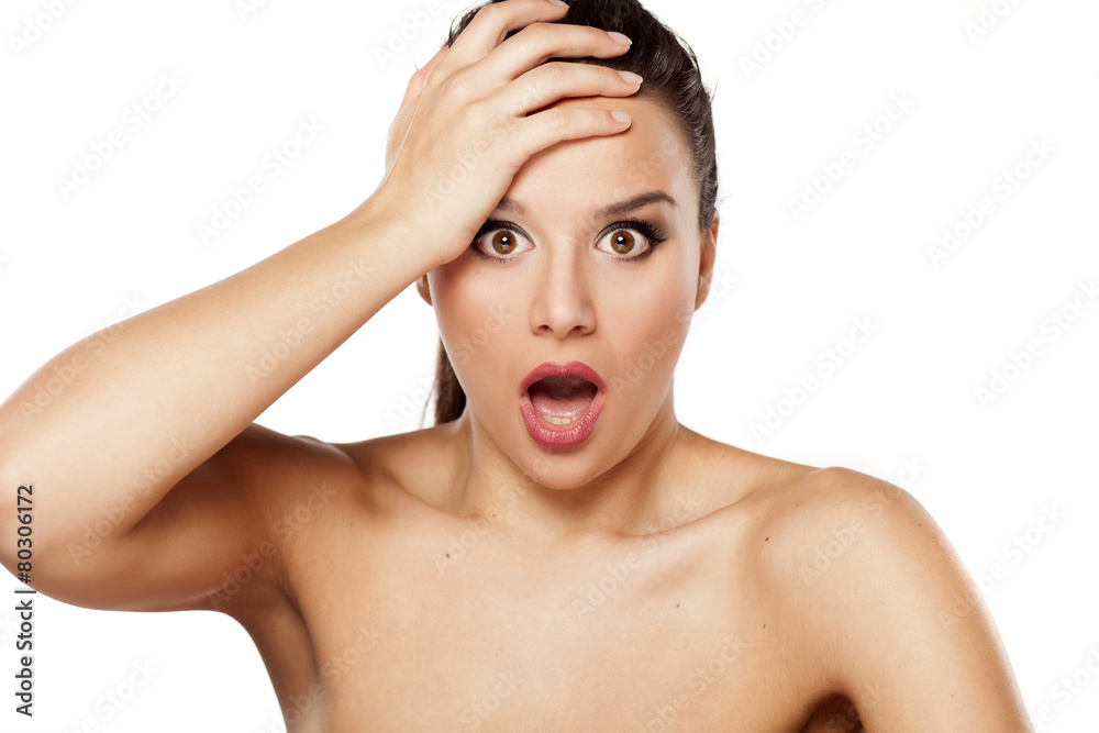 shocked beautiful woman looking at the camera shocked beautiful woman looking at the camera