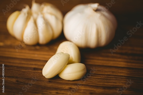 Garlic cloves and bulb on chopping board