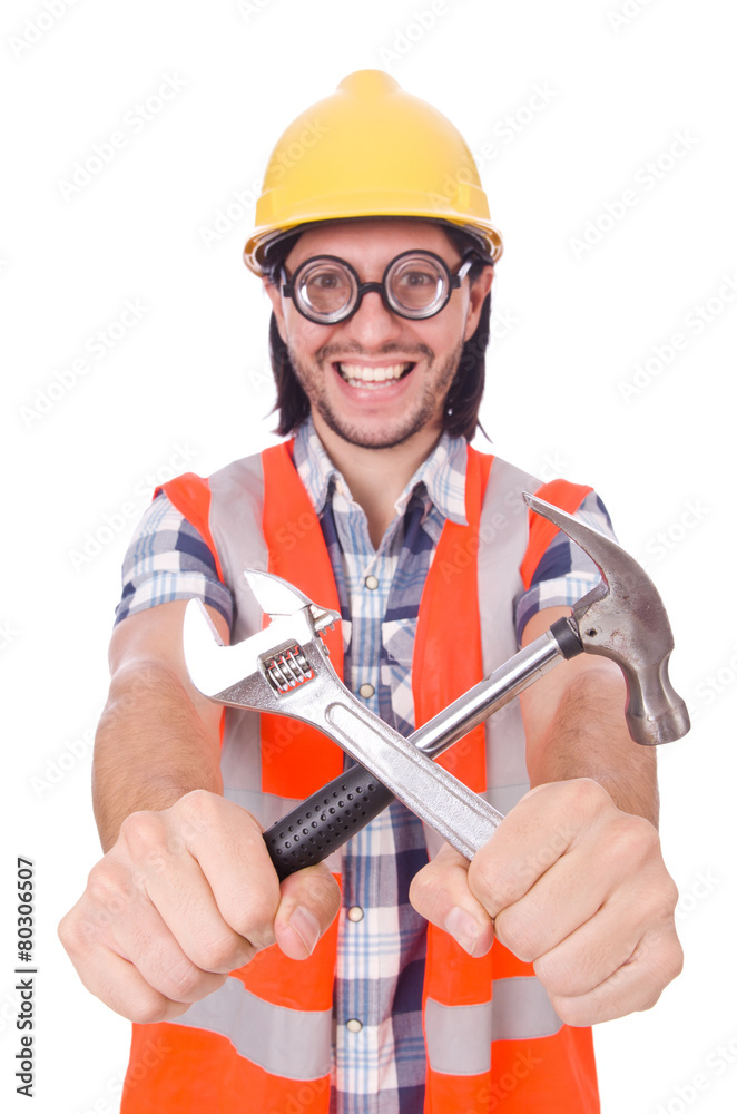 Funny young construction worker with hammer and wrench isolated