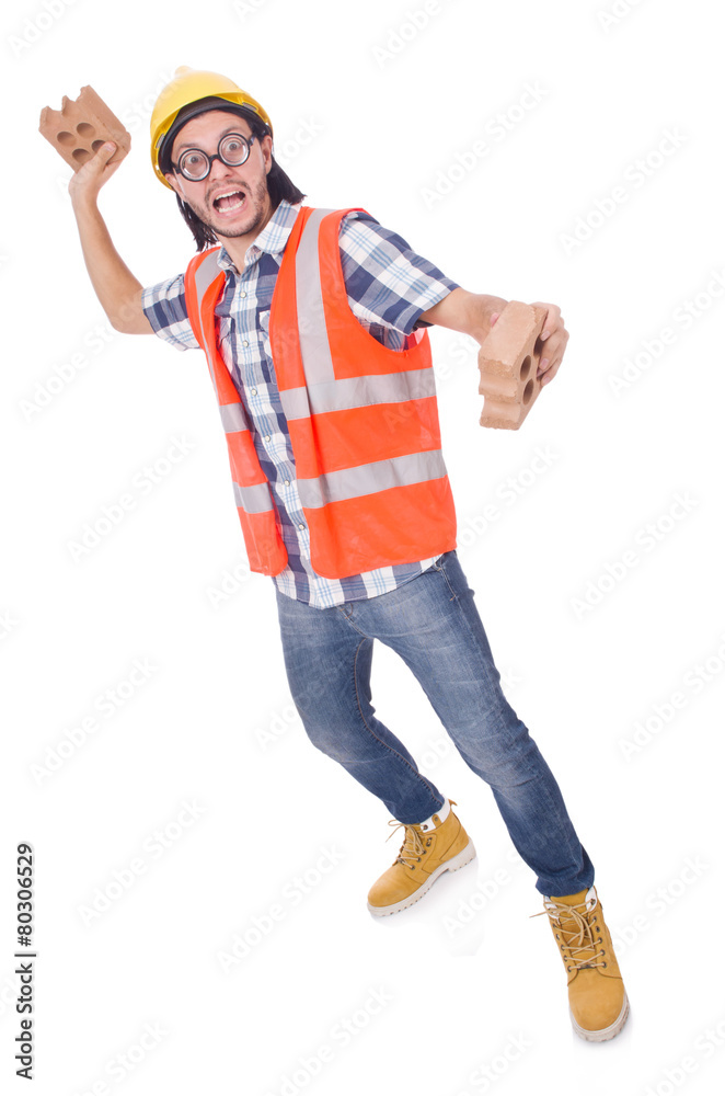 Funny young construction worker with broken brick isolated on Funny young construction worker with broken brick isolated on