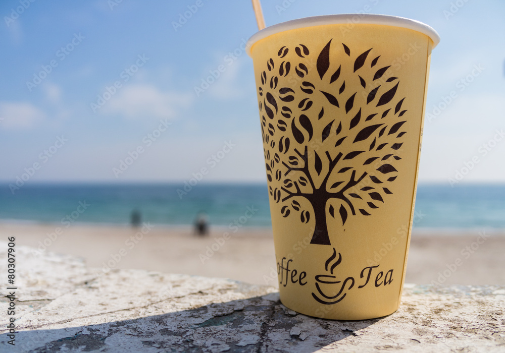 Paper cup on the beach Paper cup on the beach