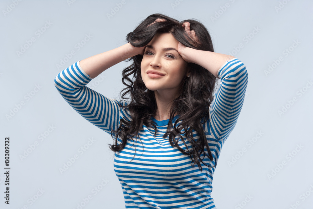 Studio portrait of a young woman. Isolated grey background. Good Studio portrait of a young woman. Isolated grey background. Good