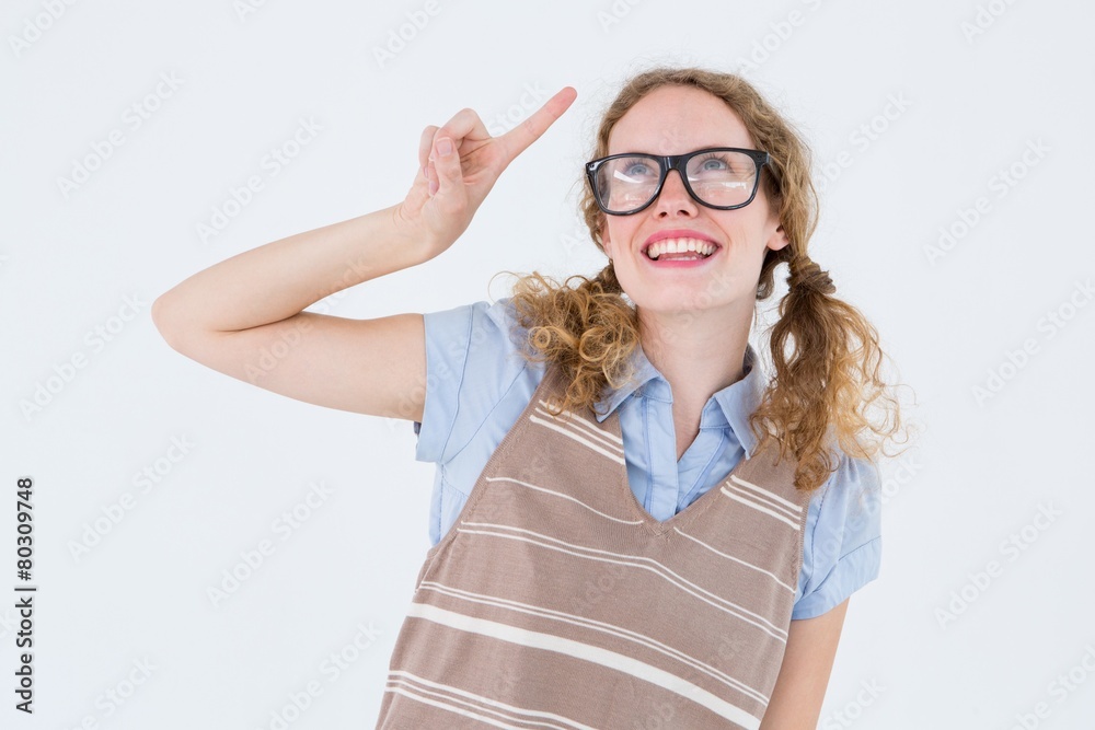 Geeky hipster woman pointing up