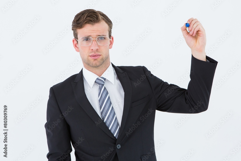 Geeky businessman writing with marker Geeky businessman writing with marker