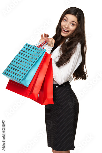 Portrait young adult girl with colored bags