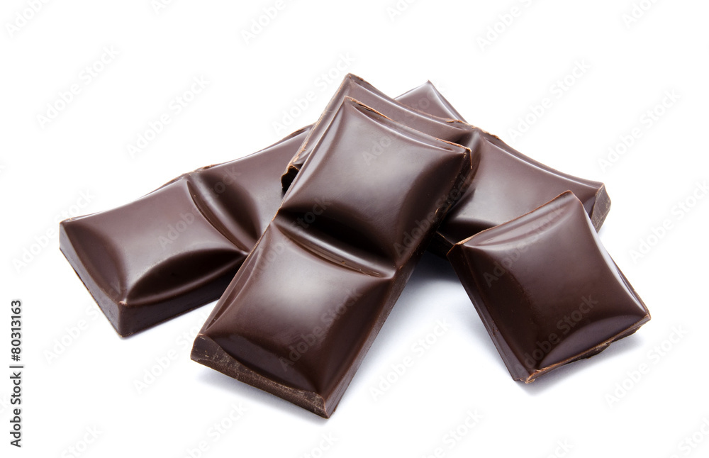 Dark chocolate bars stack with crumbs isolated Dark chocolate bars stack with crumbs isolated