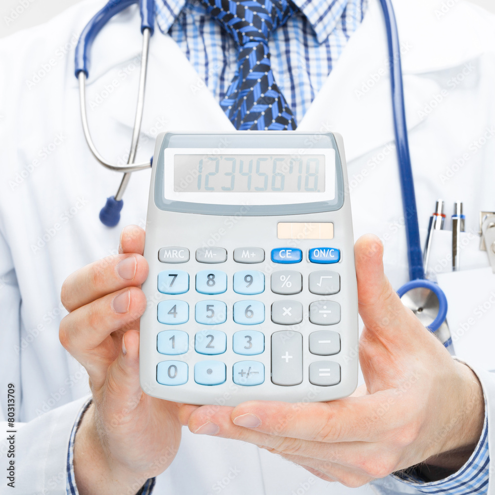 Doctor holding calculator in hands - health care concept Doctor holding calculator in hands - health care concept