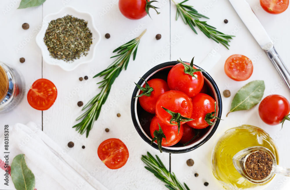 Ripe cherry tomatoes, olive oil and spices Ripe cherry tomatoes, olive oil and spices