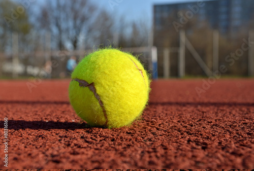 Tennis ball in a court. Useful for tennis background designs. © the_pixel