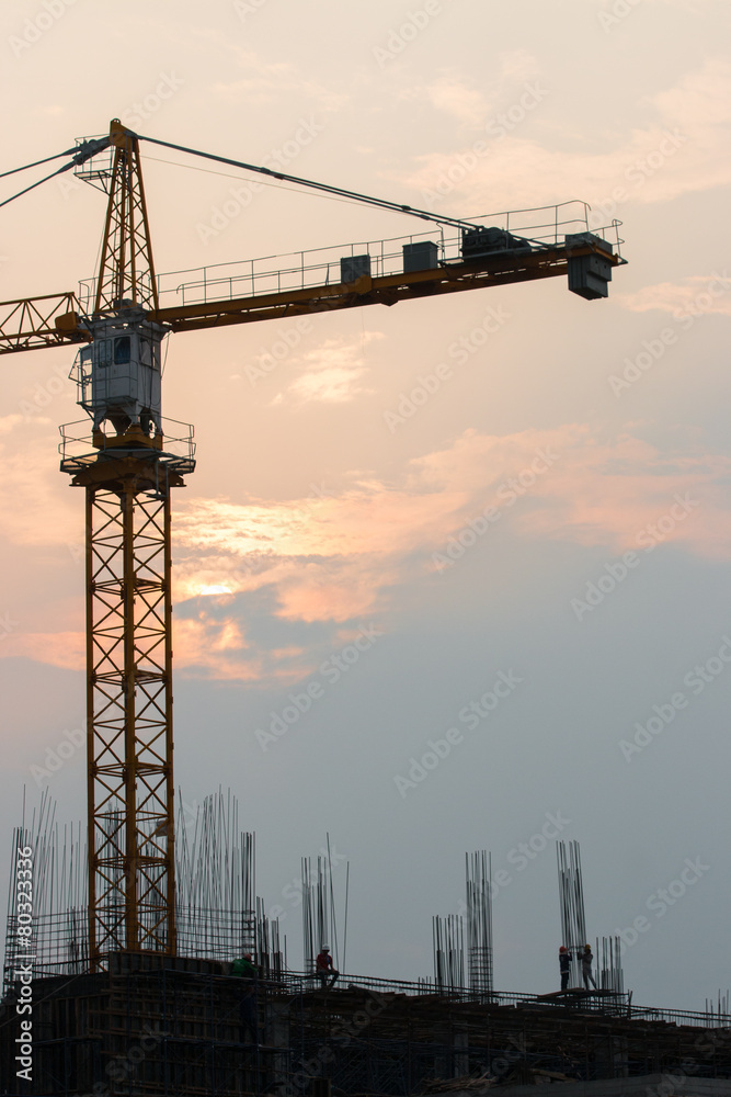 Industrial landscape with silhouettes of cranes