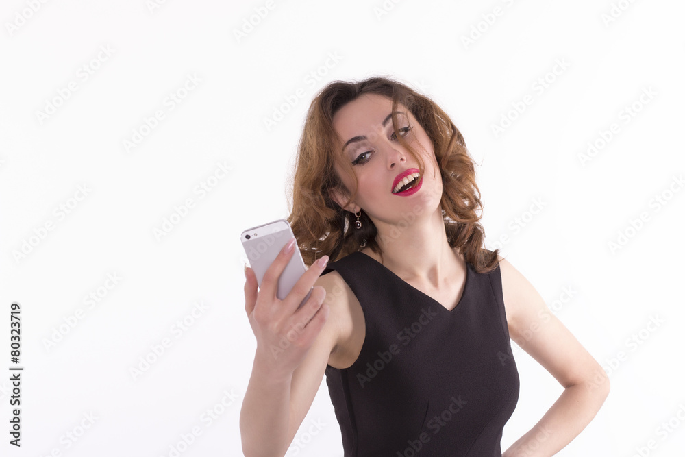 young woman take a self portrait with her smartphone young woman take a self portrait with her smartphone