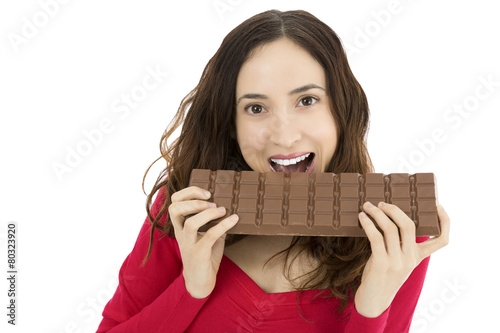 Woman biting a big chocolate bar