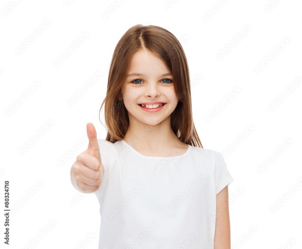 little girl in blank white tshirt showing thumbsup little girl in blank white tshirt showing thumbsup