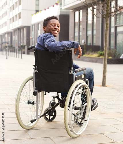 happy young man in a wheelchair © michael spring