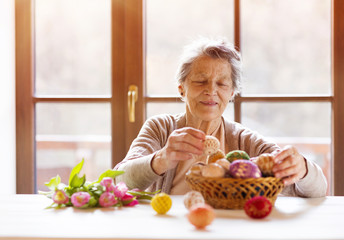 Senior woman with easter eggs