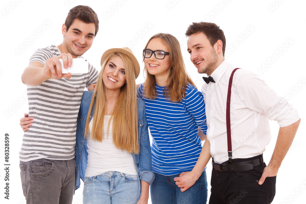 Obraz premium Four stylish young people on white background