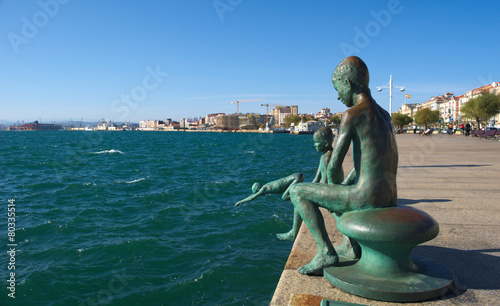 statue of the raqueros in spanish port santander. photo