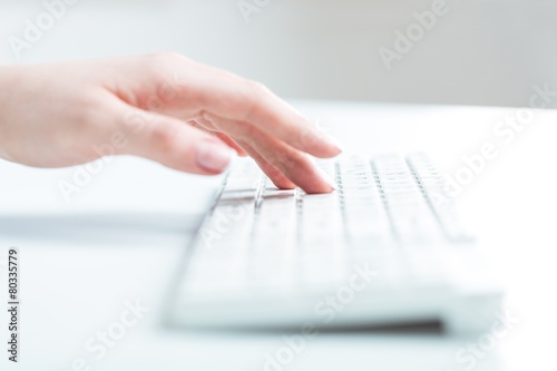 Information. Woman's hand typing on computer keyboard