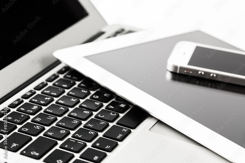 Technology. Closeup picture of a keyboard with a phone and Technology. Closeup picture of a keyboard with a phone and