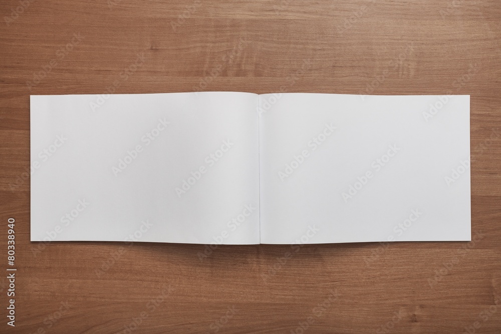 Naklejka premium Book. Blank. Booklet isolated on wooden textural background