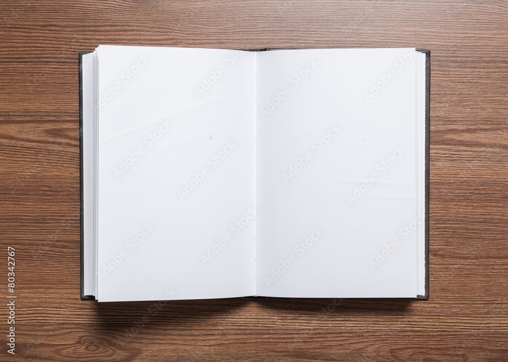 Ad. Photo blank. Open square format brochure on a wooden table Ad. Photo blank. Open square format brochure on a wooden table