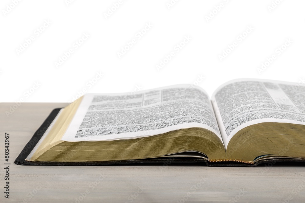 Open. Detail of an old holy bible open with a beautiful and Open. Detail of an old holy bible open with a beautiful and