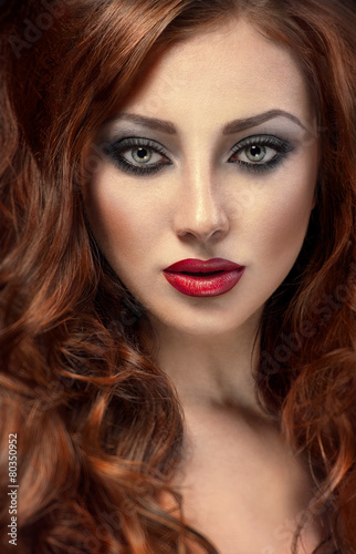Fototapeta Naklejka Na Ścianę i Meble -  Beautiful woman with posh red hair