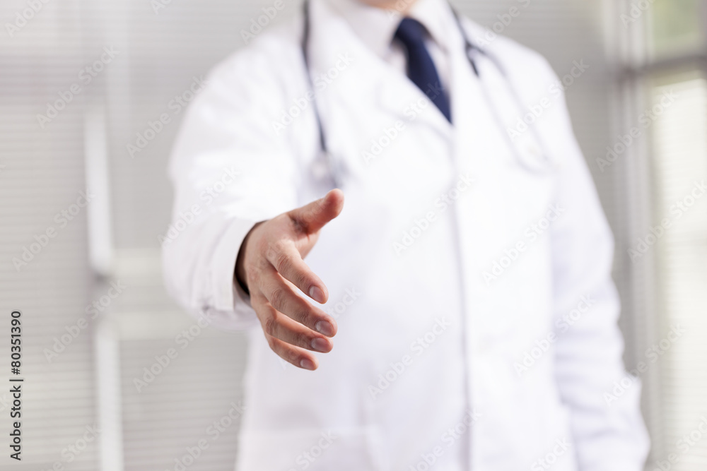 Doctor with open hand ready for handshake Doctor with open hand ready for handshake