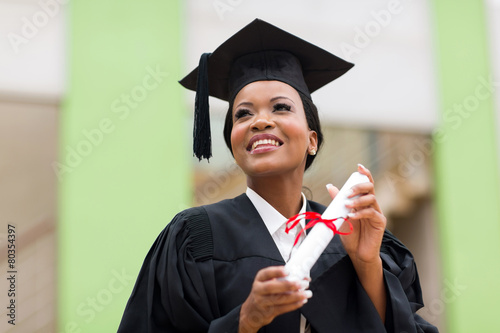 african college student in graduation cap and gown