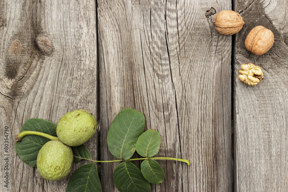 Fototapeta fresh walnuts on the wooden table